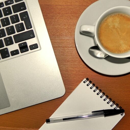 laptop-desk-writing-coffee-pen-notepadT
